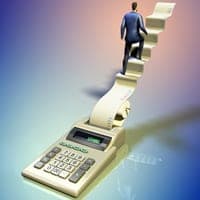 Businessman climbing a calculator sheet