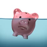 Piggy bank about to go underwater