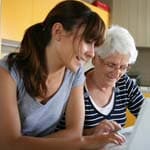 woman helping older woman