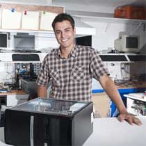 Small business owner in his computer shop