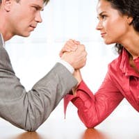 Man versus woman in arm wrestle