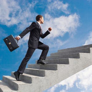 business leader walking up a flight of stairs