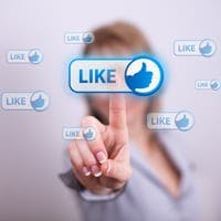 Woman pressing 'Like' on social media button