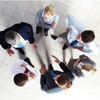 employees talking in a circle