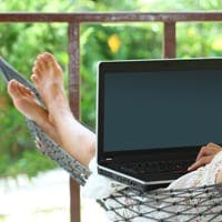 Lady working from home on a hammock