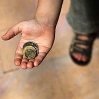 Boy holding Australian dollars in his palm