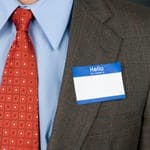 Man wearning sticky name tag