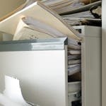 overfull filing cabinet