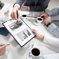 people sitting around a table planning