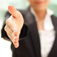 woman holding out hand for handshake