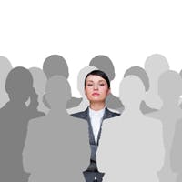 woman standing out in a crowd of silhouettes