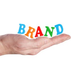 Woman's hand with "Brand" sitting in the palm