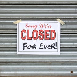 Closed sign, hung on garage sign
