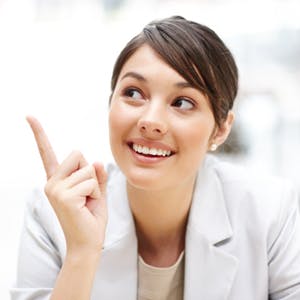 Happy businesswoman, smiling and pointing