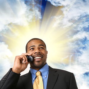 Businessman with halo of sun behind his head