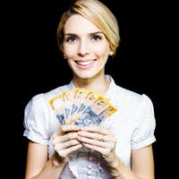 Woman with holding many $50 notes