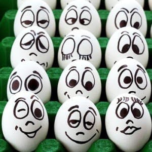 Eggs, with faces displaying various emotions painted on