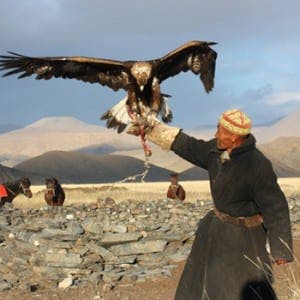 Mongolian man holding an eagle