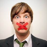 Man with red tape ober his mouth