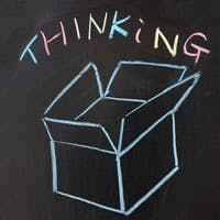 Box and "thinking" drawn on chalkboard