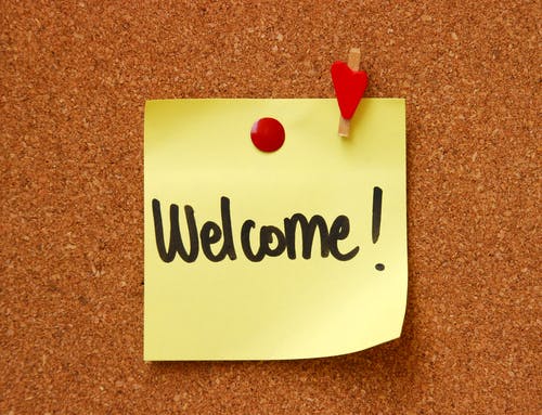 welcome on a post-it note on a pinboard