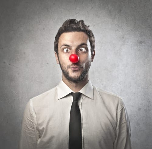 businessman wearing red nose