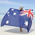 woman holding australian flag on the beach