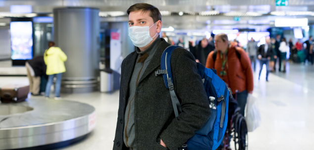 coronavirus pandemic - passenger at airport